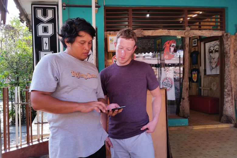 Mark Zuckerberg looking at the phone of a student in Indonesia.