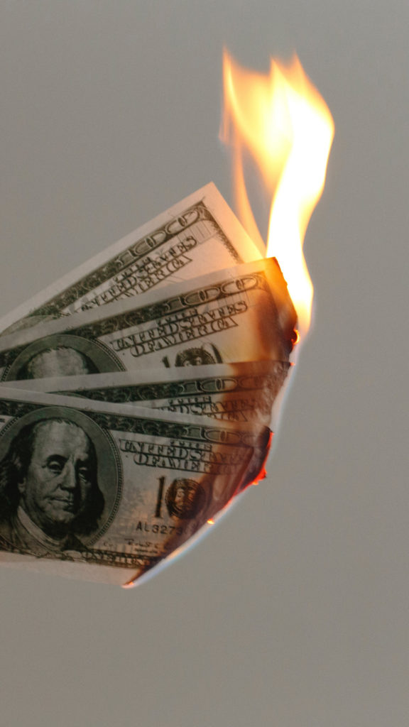Burning Money. © Jp Valery on Unsplash