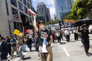 Protesters march from OpenAI headquarters to Google headquarters during a demonstration in San Francisco on Friday, July 11, 2026. © Rachel Bujalski