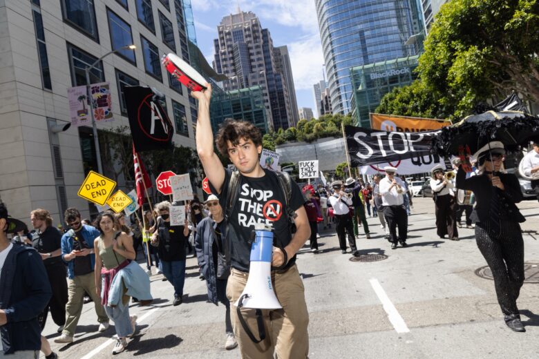Protesters march from OpenAI headquarters to Google headquarters during a demonstration in San Francisco on Friday, July 11, 2026. © Rachel Bujalski
