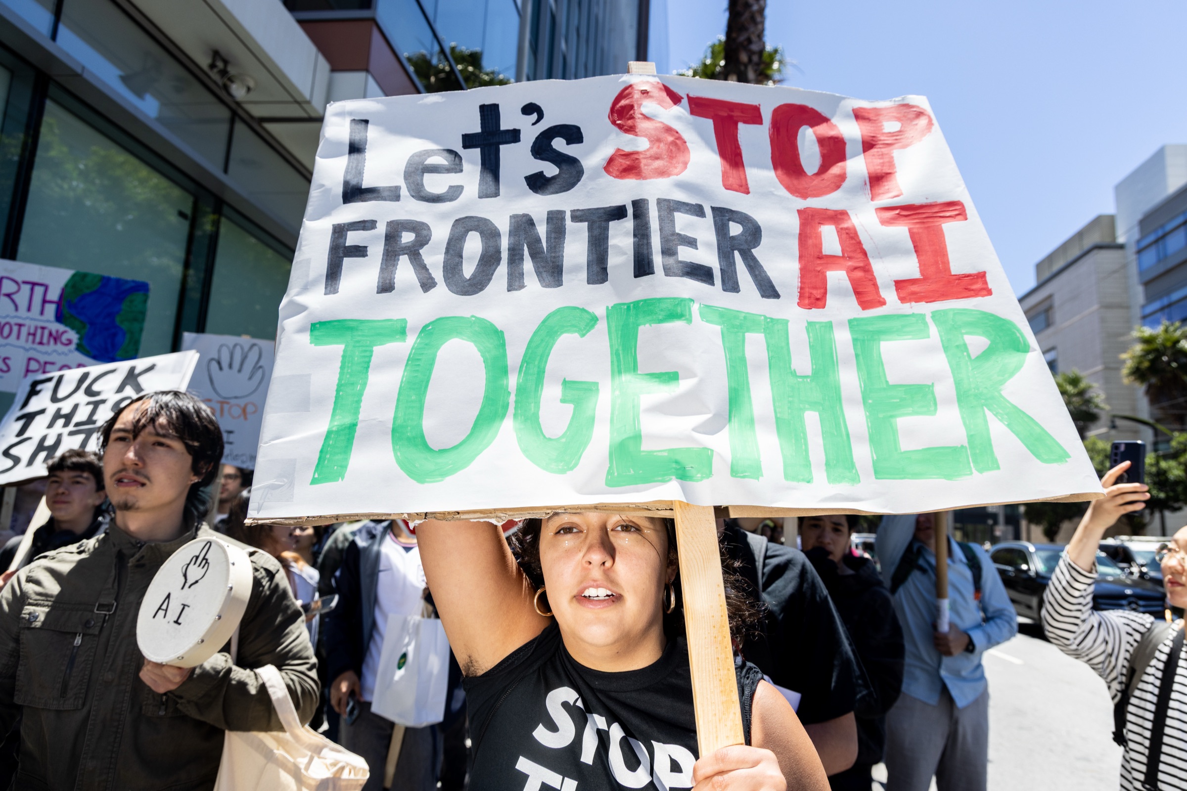 Protesters march from OpenAI headquarters to Google headquarters during a demonstration in San Francisco on Friday, July 11, 2026. © Rachel Bujalski